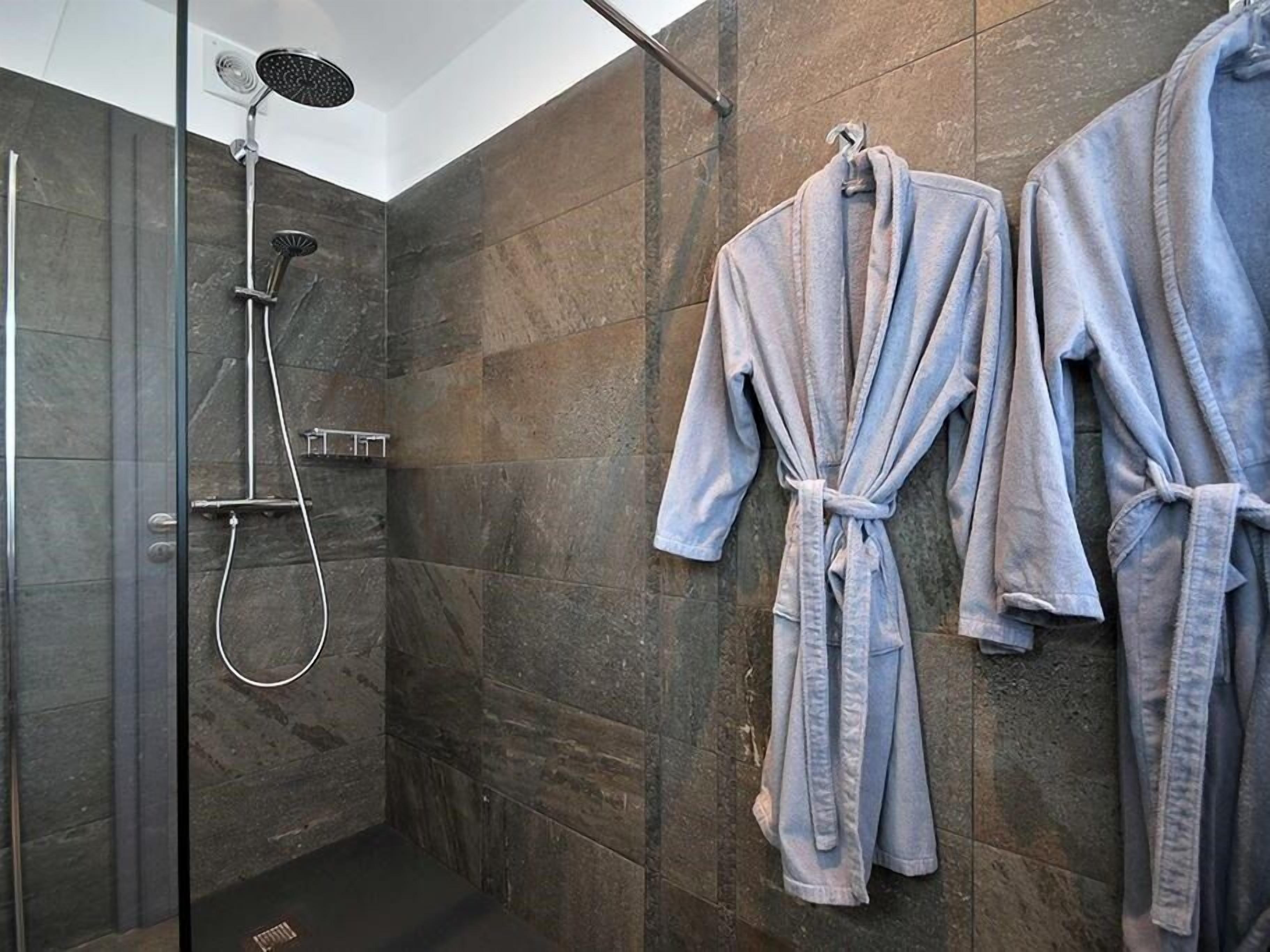 Bathroom | Shower, free toiletries, hair dryer, slippers