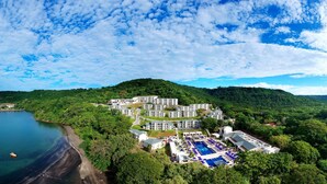 An aerial view of a resort with multiple buildings, a swimming pool, and a beach. - Planet Hollywood Costa Rica by Royalton, An Autograph Collection All-Inclusive Resort (Nacascolo)
