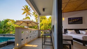 A balcony with a pool, a bed, and a chair. - Hoi An Corn Riverside Villa (Da Nang)