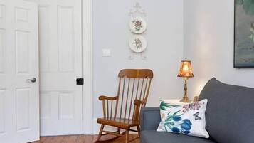 Suite, 1 King Bed with Sofa bed | Living room | 55-inch TV with cable channels