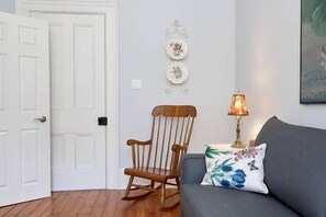 Suite, 1 King Bed with Sofa bed | Living room | 55-inch TV with cable channels - Cheltenham Suites (Caledon)