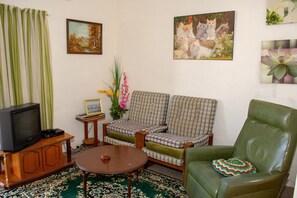Basic Apartment, 1 Bedroom | Living room | 24-inch LCD TV with satellite channels
