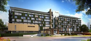 Experience the Tinidee hotel's sleek design, featuring a mix of glass and wood paneling, with balconies and a variety of room layouts.