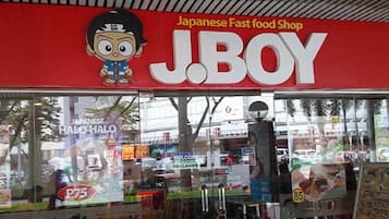 A J.BOY Japanese fast food shop with a large cartoon character logo.