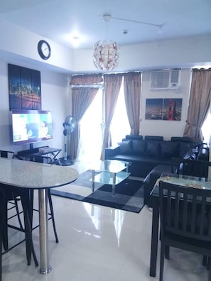 Family Apartment, 2 Bedrooms, Pool Access, Poolside | Living room | 42-inch flat-screen TV with digital channels, TV, Netflix