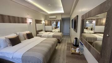 Family Triple Room, Multiple Beds, Non Smoking, City View | Premium bedding, minibar, desk, blackout curtains