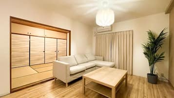 Family Suite, 3 Bedrooms | Living area | Flat-screen TV