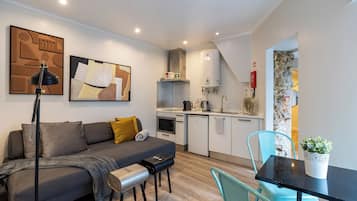 Standard Apartment, Courtyard View | Living area | Flat-screen TV