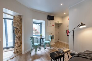 Standard Apartment, Courtyard View | Living area | Flat-screen TV