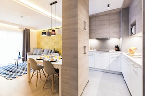 Superior Apartment, 1 Bedroom, Balcony | Living area | 60-cm flat-screen TV with cable channels, TV