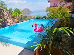 Outdoor pool, open 9:30 AM to 7:30 PM, pool loungers