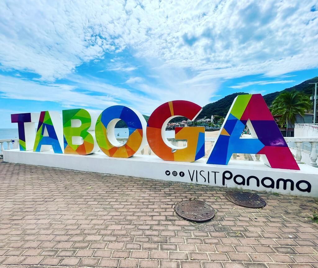 A colorful sign with the word "TABOGA" and the phrase "VISIT Panama" on a white background.