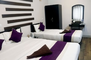 Family Triple Room, Multiple Beds, Private Bathroom | Desk, laptop workspace, iron/ironing board, free WiFi