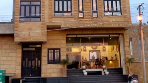 A multi-story building with a prominent entrance, a staircase leading to the ground floor, and a sign indicating the name 'Shree Shankar Tower'. - Hotel Radhika Jaisalmer (Jaisalmer)
