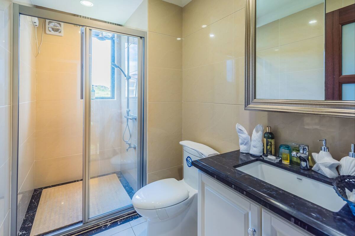 Shower, free toiletries, slippers, towels