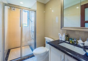 Shower, free toiletries, slippers, towels