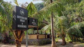A sign for Crystal Bay Villa & Residence with a restaurant named Astiti. - Crystal Bay Villa (Penida Island)