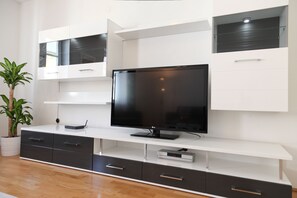 Appartement Premium, plusieurs lits, balcon | Coin séjour