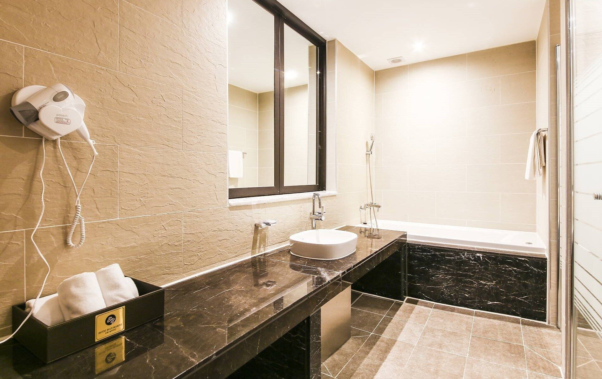 yellow marine (city view double) | bathroom | combined shower/bathtub, free toiletries, hair dryer, towels