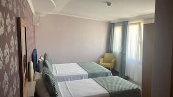 Family Triple Room, City View | Premium bedding, minibar, desk, laptop workspace