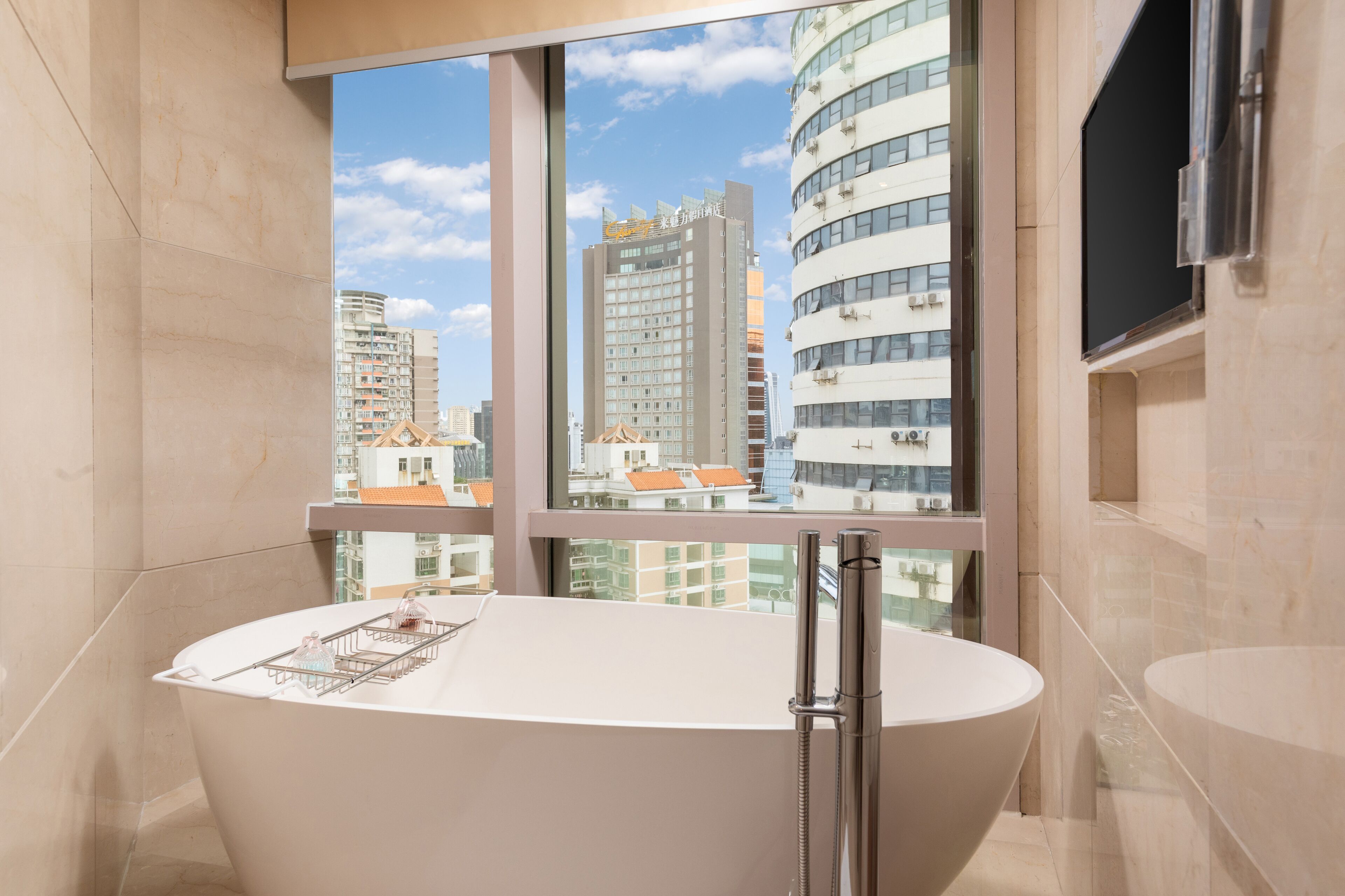 deluxe business suite | bathroom | shower, free toiletries, hair dryer, bathrobes