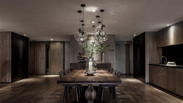 A modern dining area with a large wooden table, multiple chairs, and a central decorative vase. - Chongqing David‘s Deer Boutique Hotel (Chongqing)
