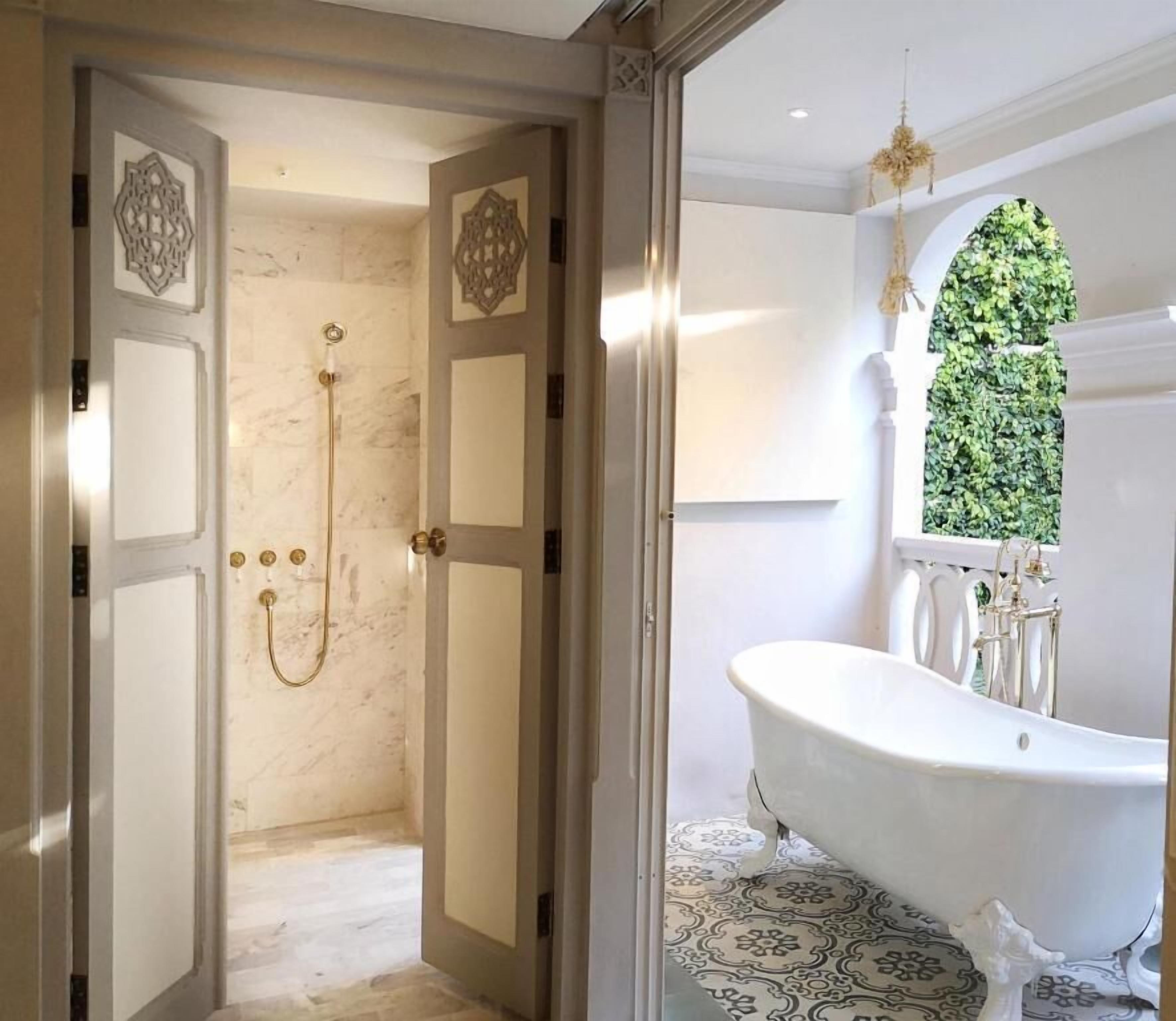 separate bathtub and shower, deep-soaking bathtub, rainfall showerhead