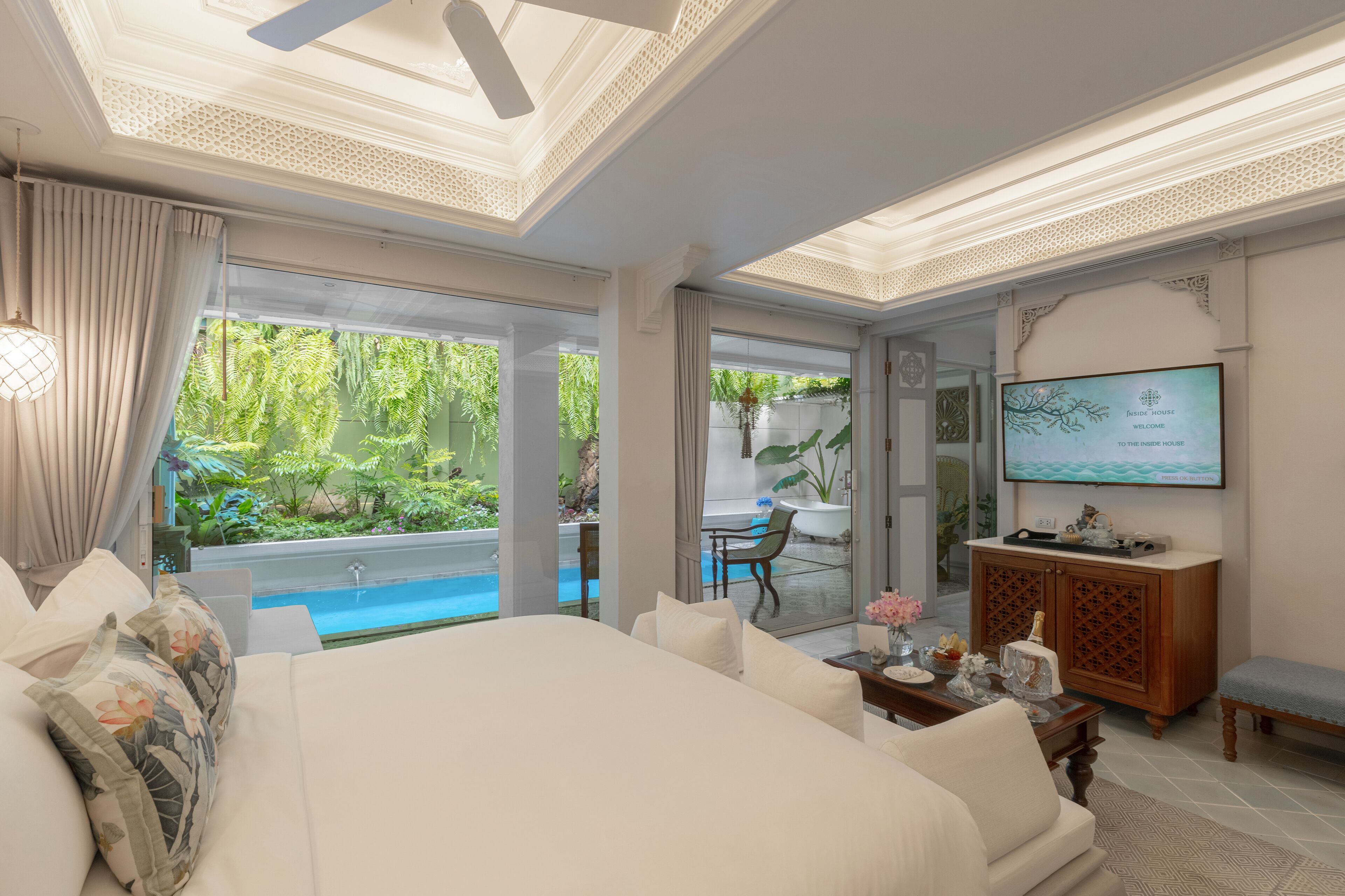 the waterfall pool suite | premium bedding, free minibar, in-room safe, blackout curtains