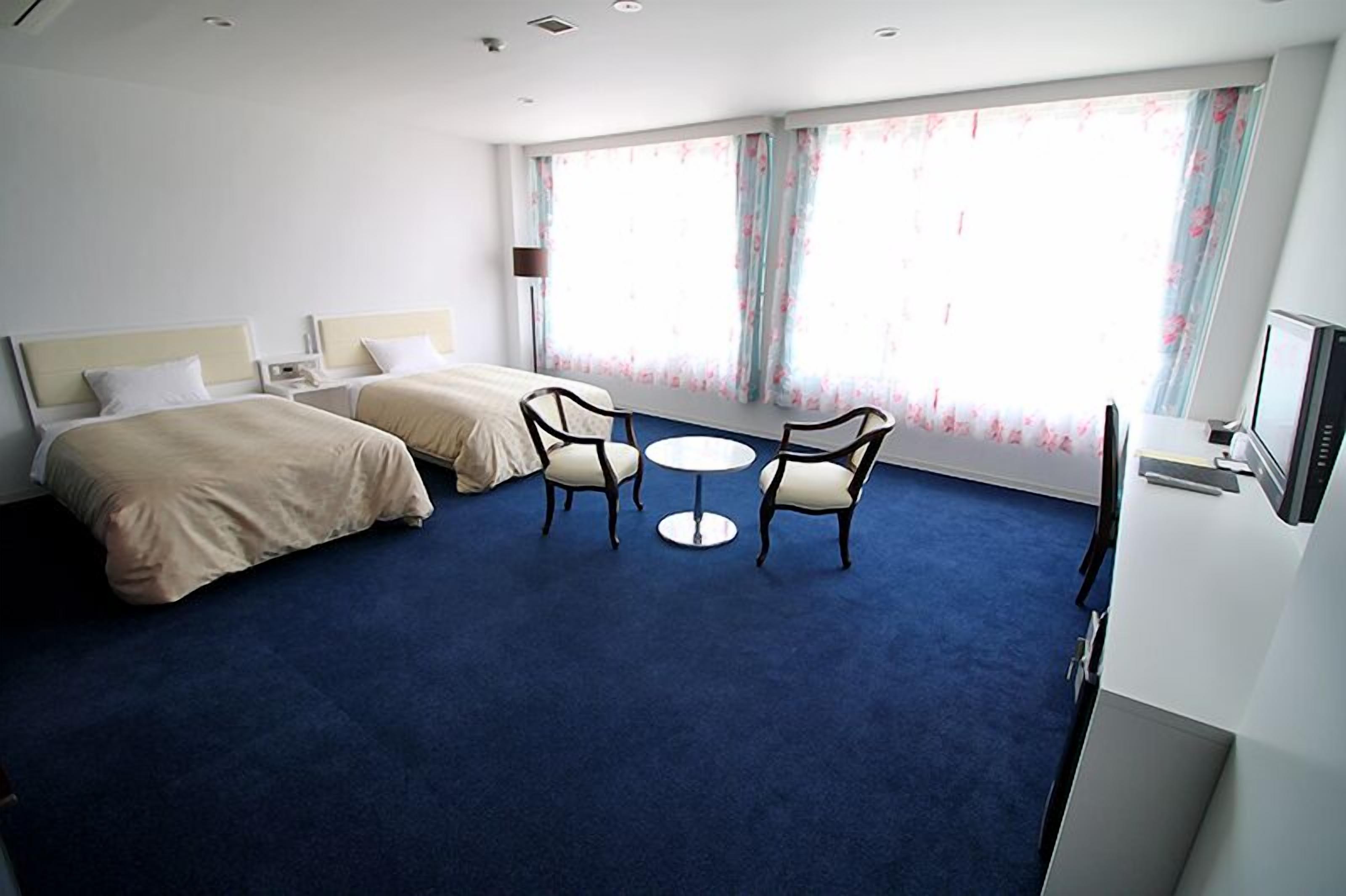 deluxe twin room | in-room safe, desk, laptop workspace, soundproofing