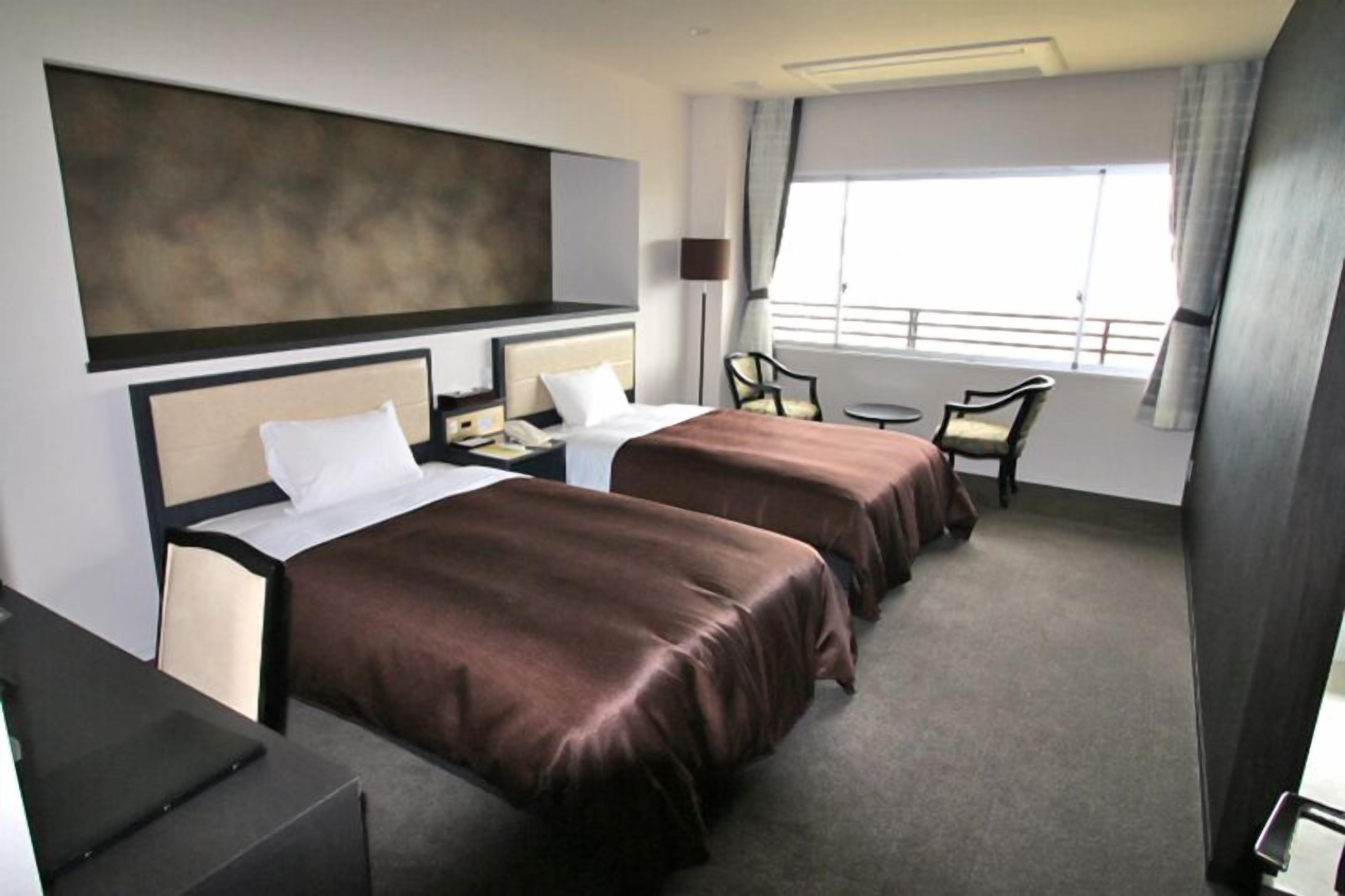 loyal twin room a | in-room safe, desk, laptop workspace, soundproofing