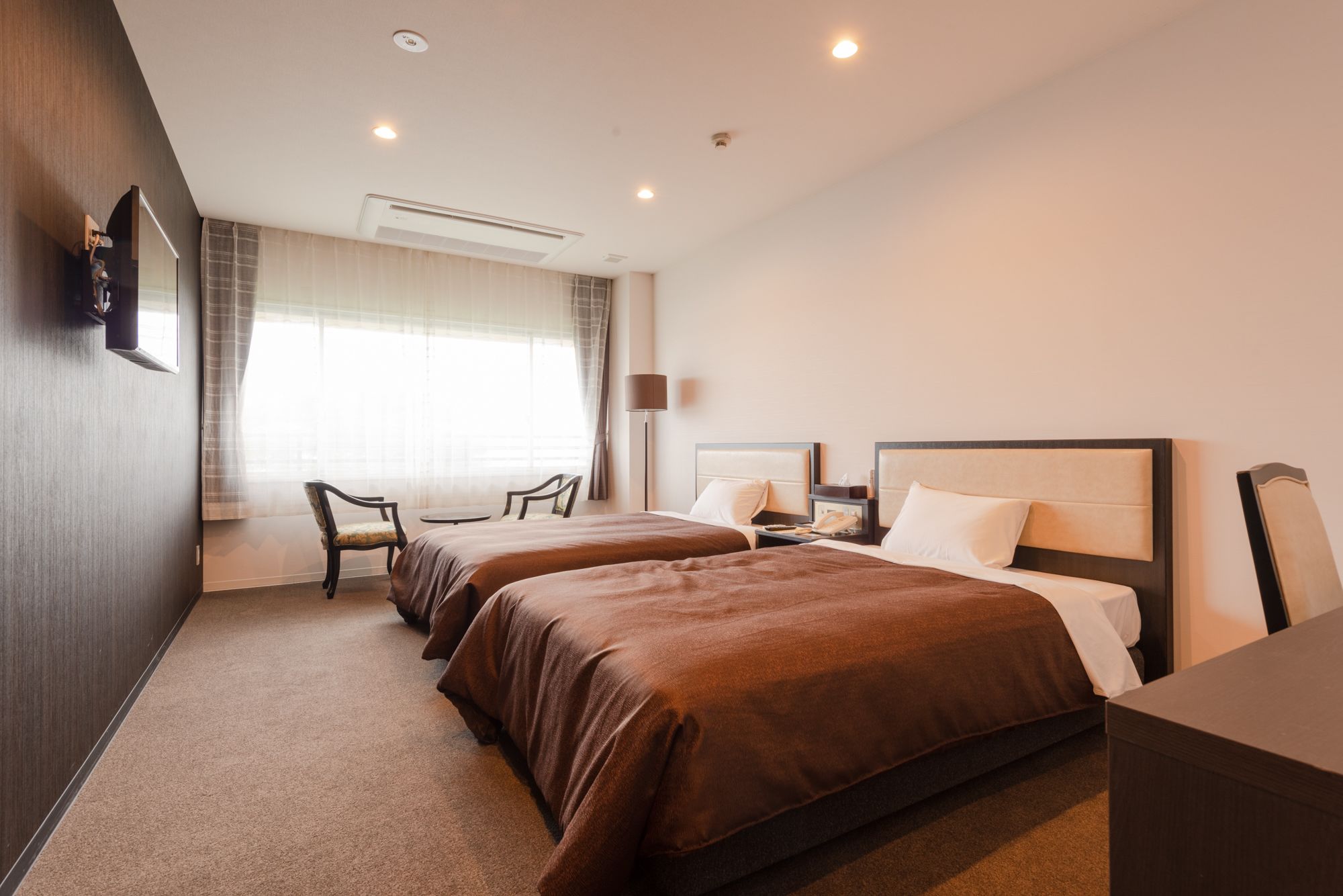 loyal twin room a | in-room safe, desk, laptop workspace, soundproofing