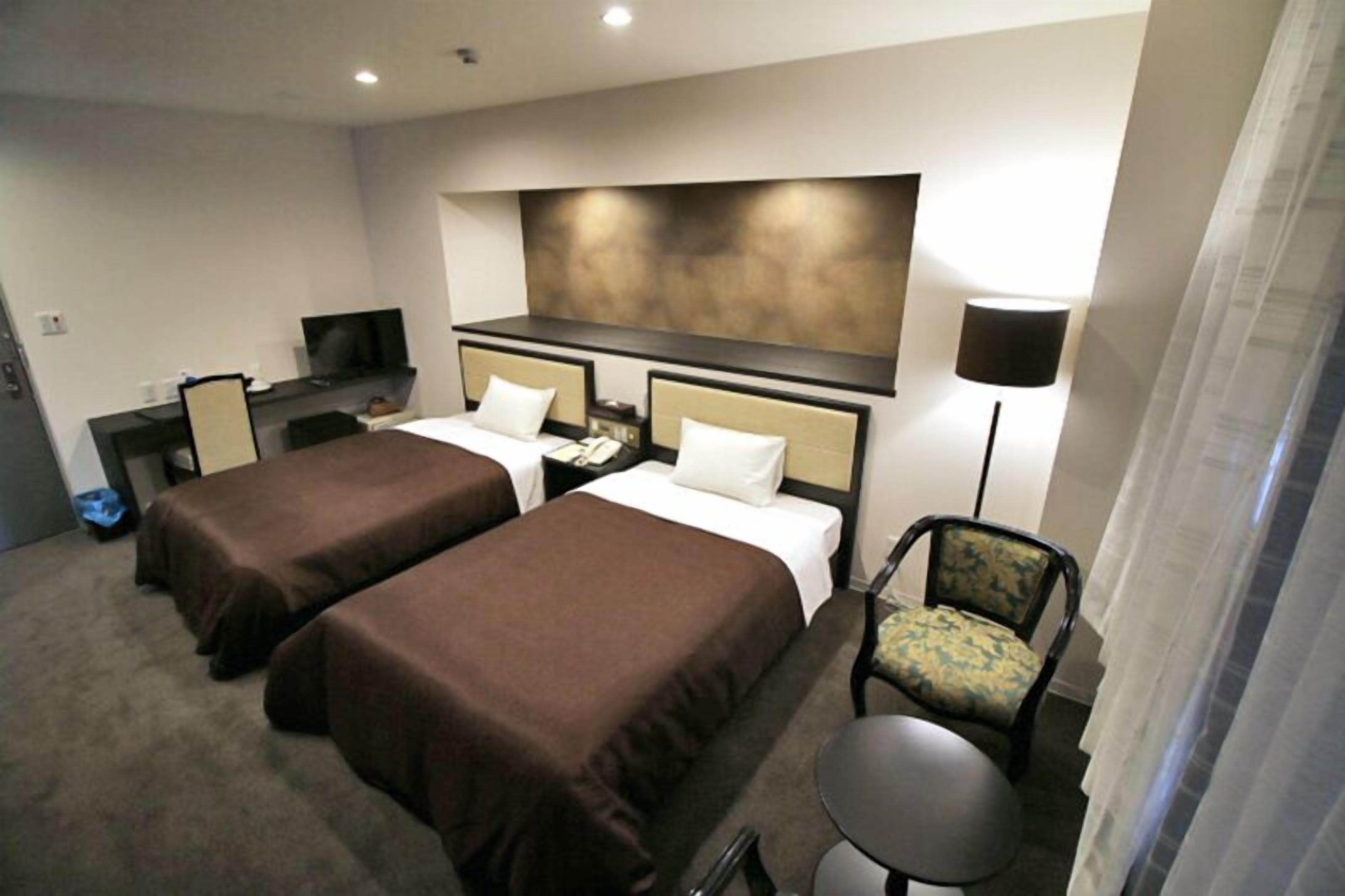 loyal twin room a | in-room safe, desk, laptop workspace, soundproofing