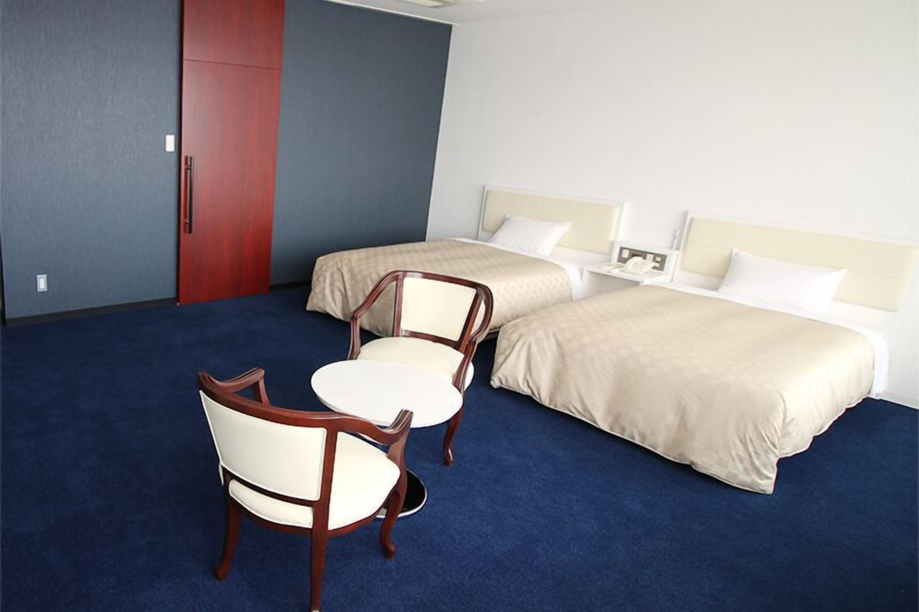 deluxe twin room | in-room safe, desk, laptop workspace, soundproofing