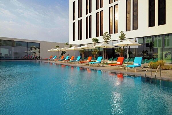 Outdoor pool, open 6:00 AM to 9:00 PM, pool umbrellas, pool loungers