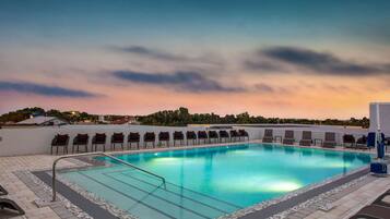 Outdoor pool, open 9:00 AM to 9:00 PM, sun loungers