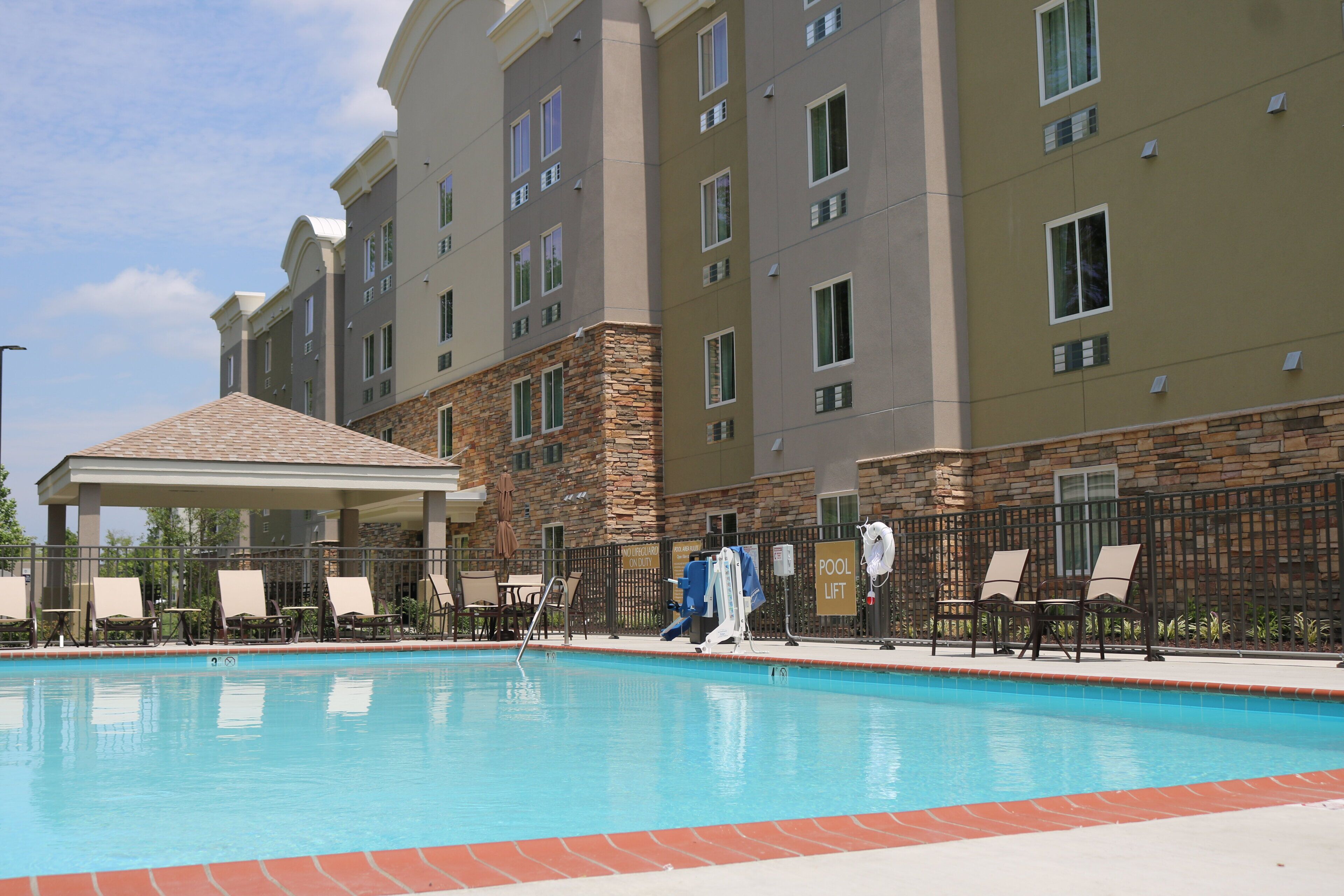 Seasonal outdoor pool, open 7 AM to 10 PM, pool loungers