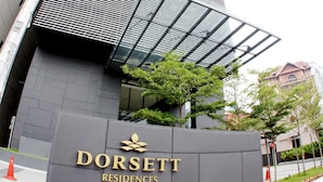 A modern building with a curved facade and a prominent entrance sign for Dorsett Residences Bukit Bintang. - Dorsett Residences Bukit Bintang by De Space (Kuala Lumpur)