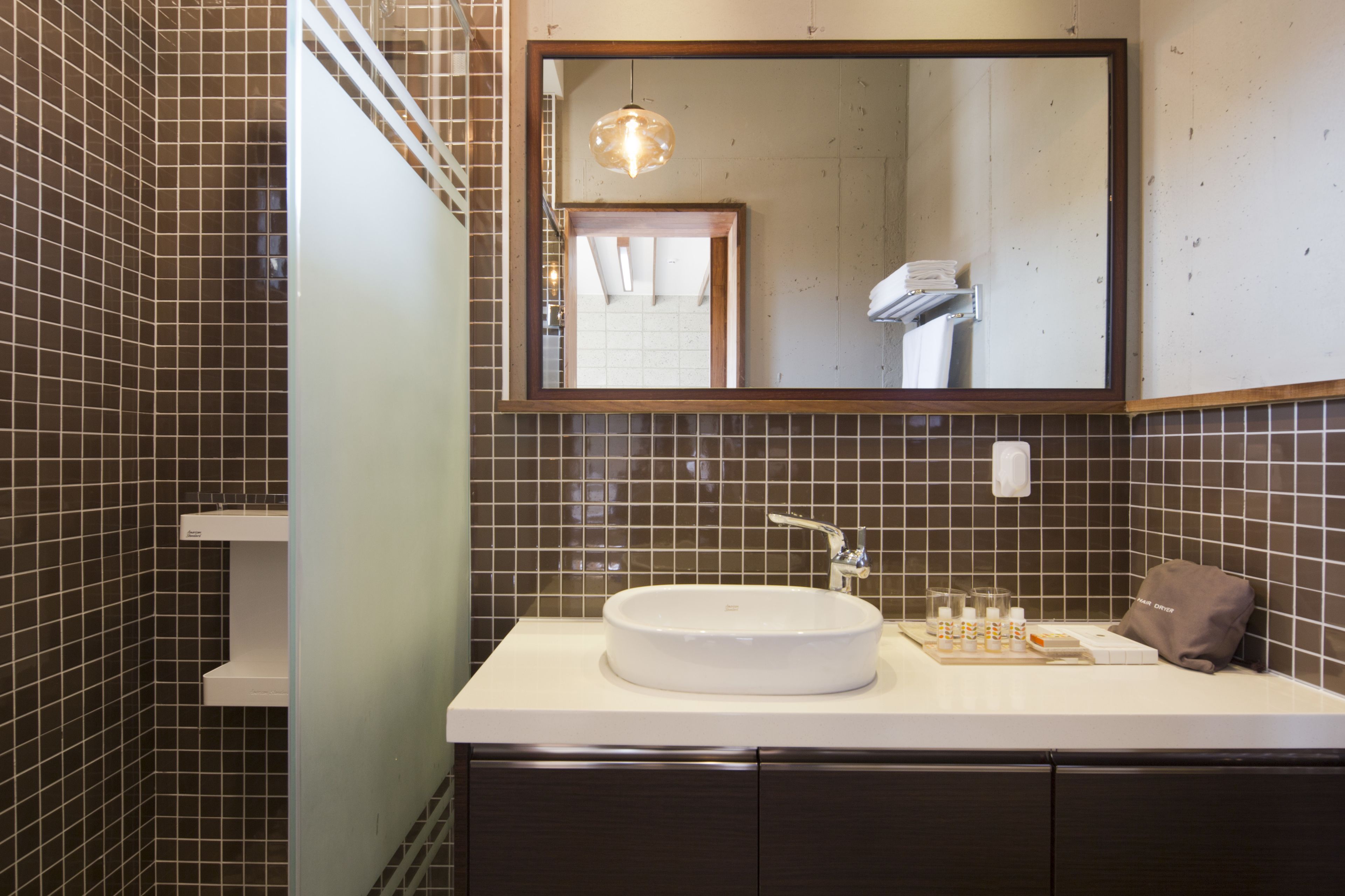 family suite | bathroom | combined shower/bathtub, designer toiletries, hair dryer, slippers
