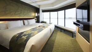 A hotel room with two beds, a large window, a flat-screen TV, and a bench. - Hotel 1899 Tokyo (Tokyo)