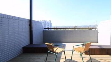 Quarto casal luxo, sacada | Terraço/pátio