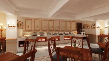 A hotel dining area with wooden tables and chairs, buffet counters, and wall-mounted light fixtures.