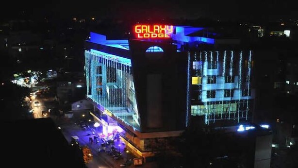 A building with a sign reading "GALAXY LODGE" at the top. - Galaxy Inn (Kolhapur)