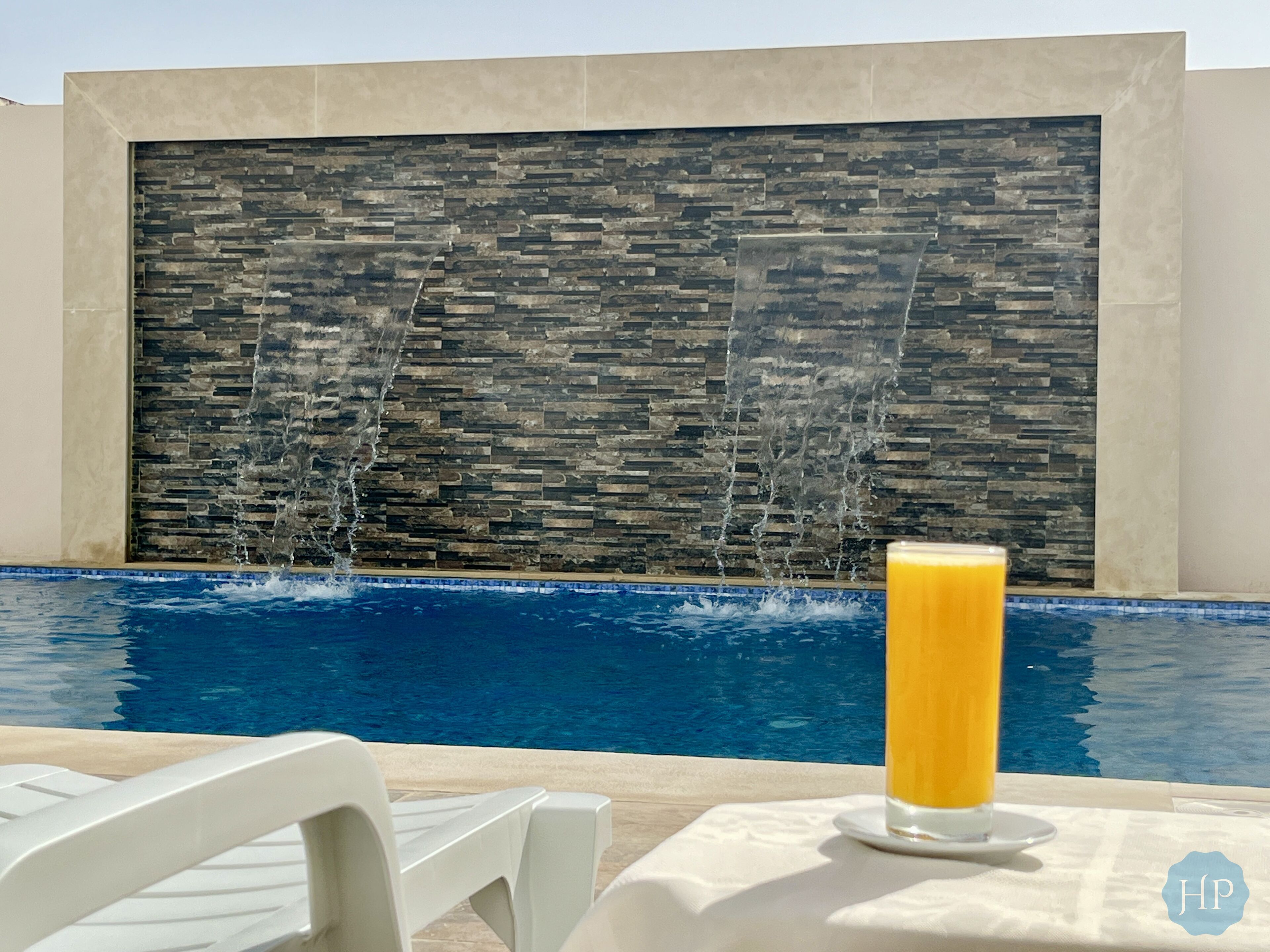 outdoor pool, open 10:30 am to 8:00 pm, pool umbrellas