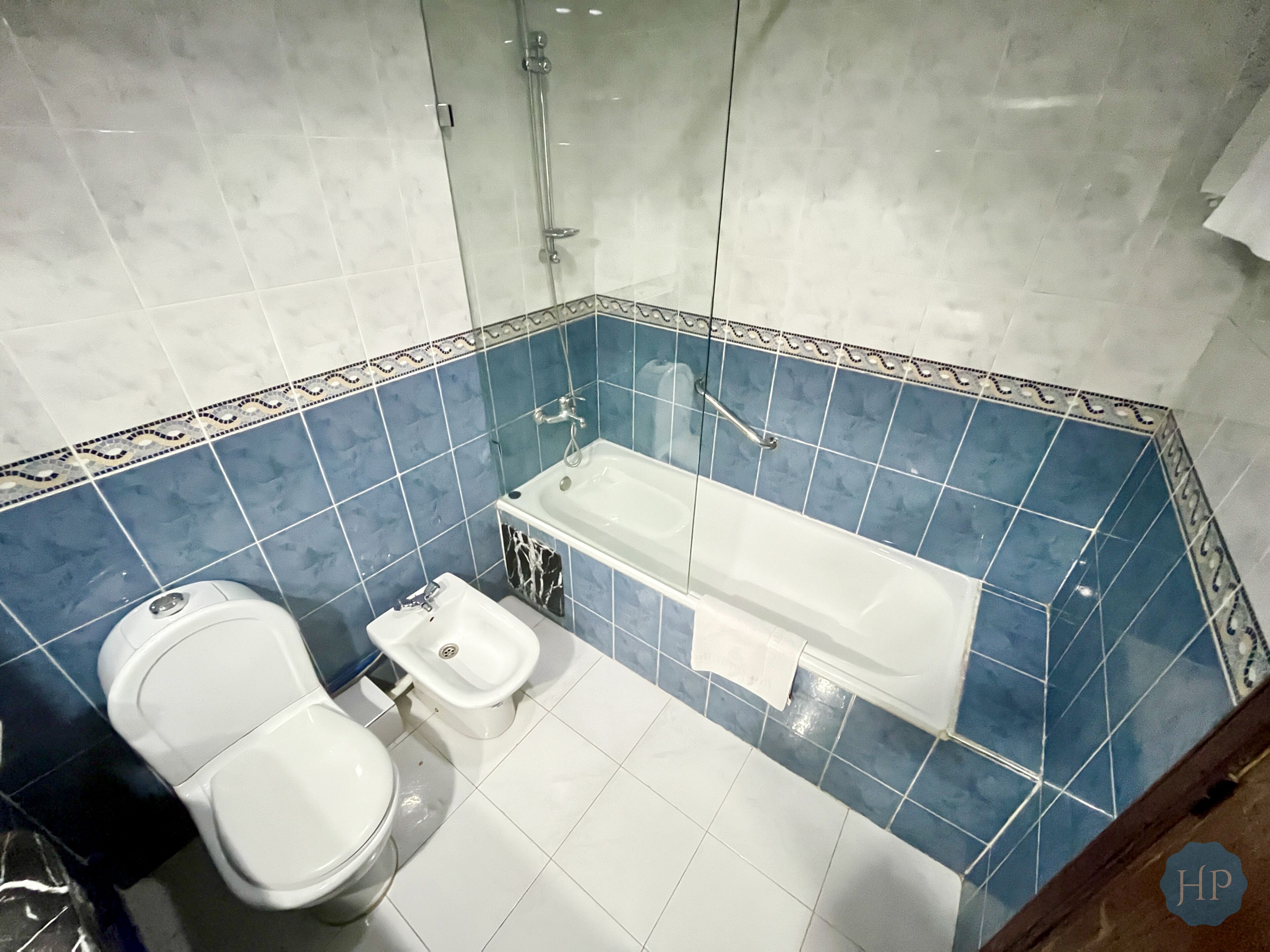 deep-soaking bathtub, rainfall showerhead, free toiletries, bathrobes