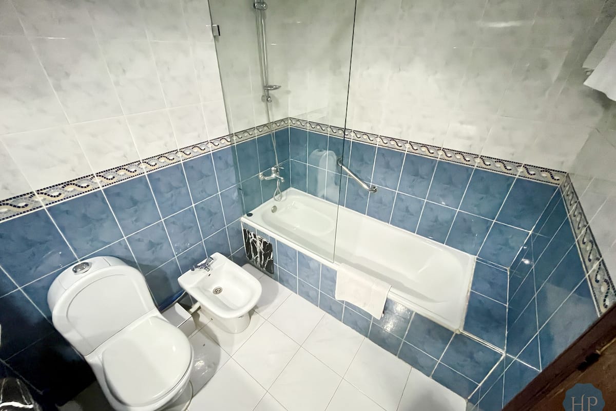 deep-soaking bathtub, rainfall showerhead, free toiletries, bathrobes