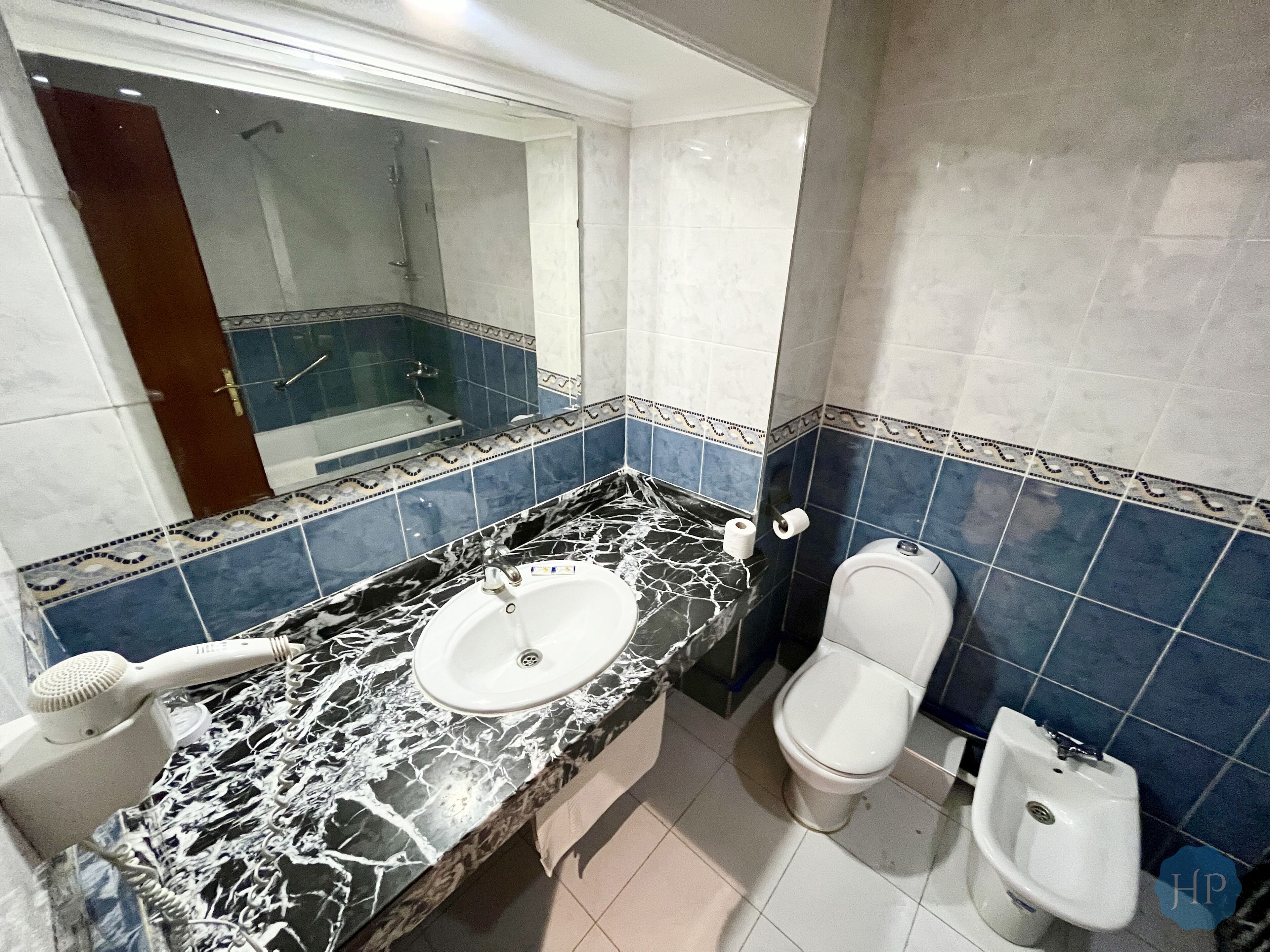 deep-soaking bathtub, rainfall showerhead, free toiletries, bathrobes