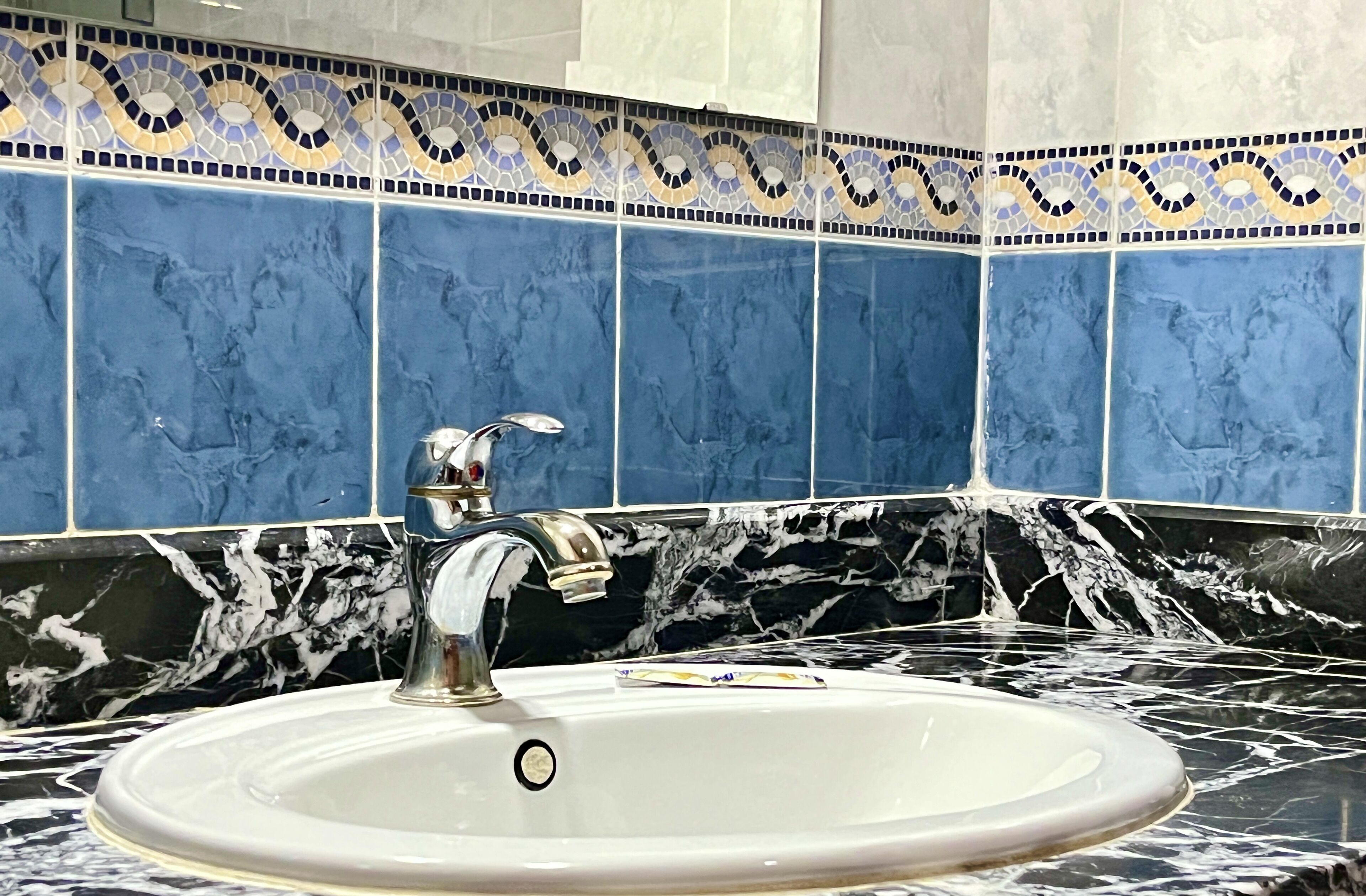 deep-soaking bathtub, rainfall showerhead, free toiletries, bathrobes