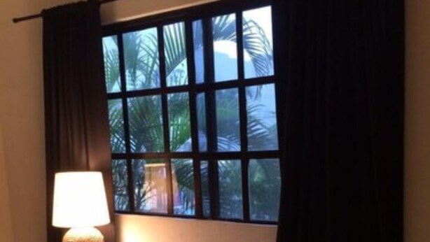 A room with a white bench, a lamp, and a window with curtains. - Hacienda San José 647 by Sinbad (Playa del Carmen)