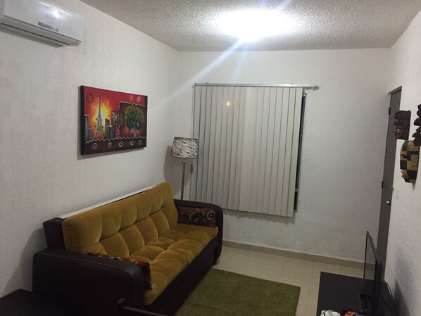 Comfort Apartment, Multiple Beds | Living area | Flat-screen TV