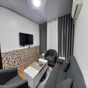 Apartment, 2 Bedrooms | Living area | 36-inch flat-screen TV with satellite channels, TV - Al-Nujoom Hotel Suites (Amman)